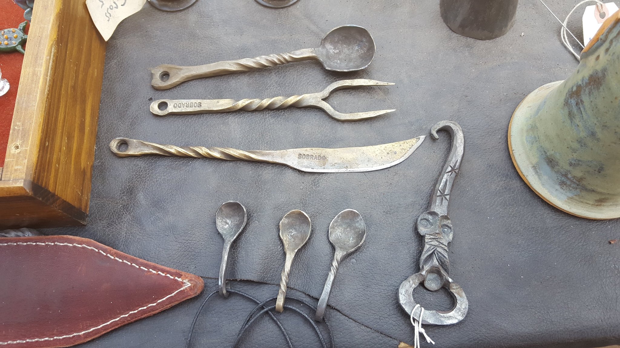 Hand-forged spoons, fork, and butter knife with twisted handles.